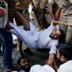 Police remove protesters in Kochi.